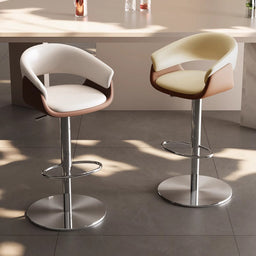 In a modern minimalist indoor space, there are two liftable bar stools with color-blocking design; the seats feature white-brown and beige-brown contrasts, paired with silver metal bases, and the sunlight casts a warm glow that highlights their texture.