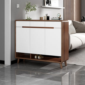 White cabinet with wooden accents in a living room setting