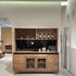 Wooden kitchen cabinet with shelves and countertop in a modern interior setting