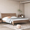 Wooden bed in a bedroom with neutral decor