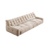 A light beige quilted fabric sofa with a plump, soft appearance.