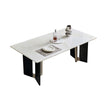 Dining table with a white marble-like surface and black legs on a white background
