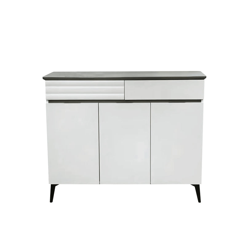 White cabinet with black top on a white background