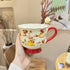 Handled teacup with rabbit illustration and cream spoon